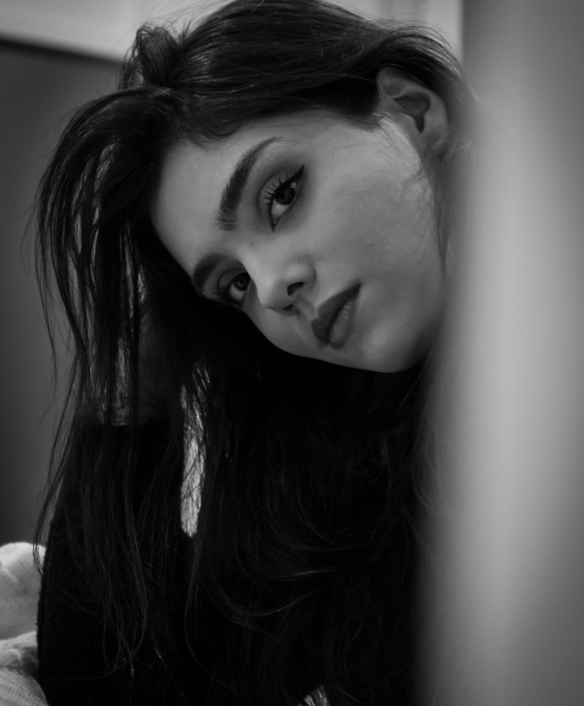 Black and white portrait of a Farmington facelift model.