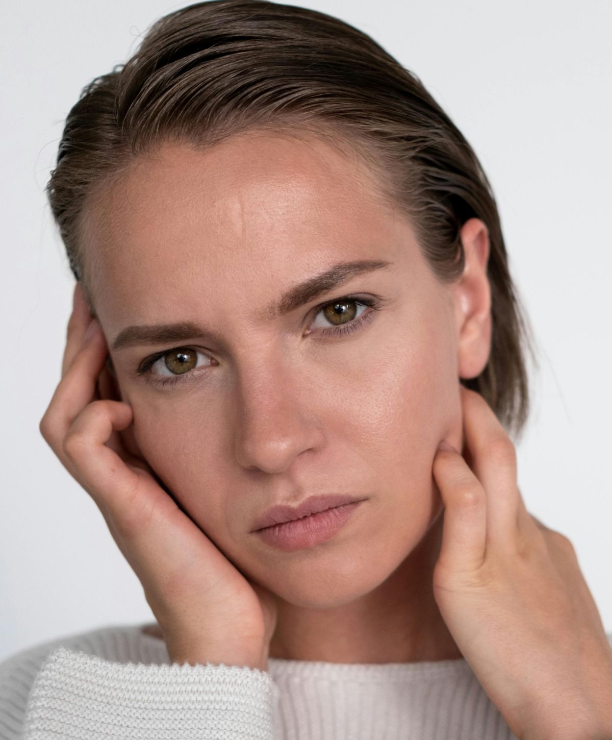 Close-up portrait of Farmington Botox model with neutral expression.