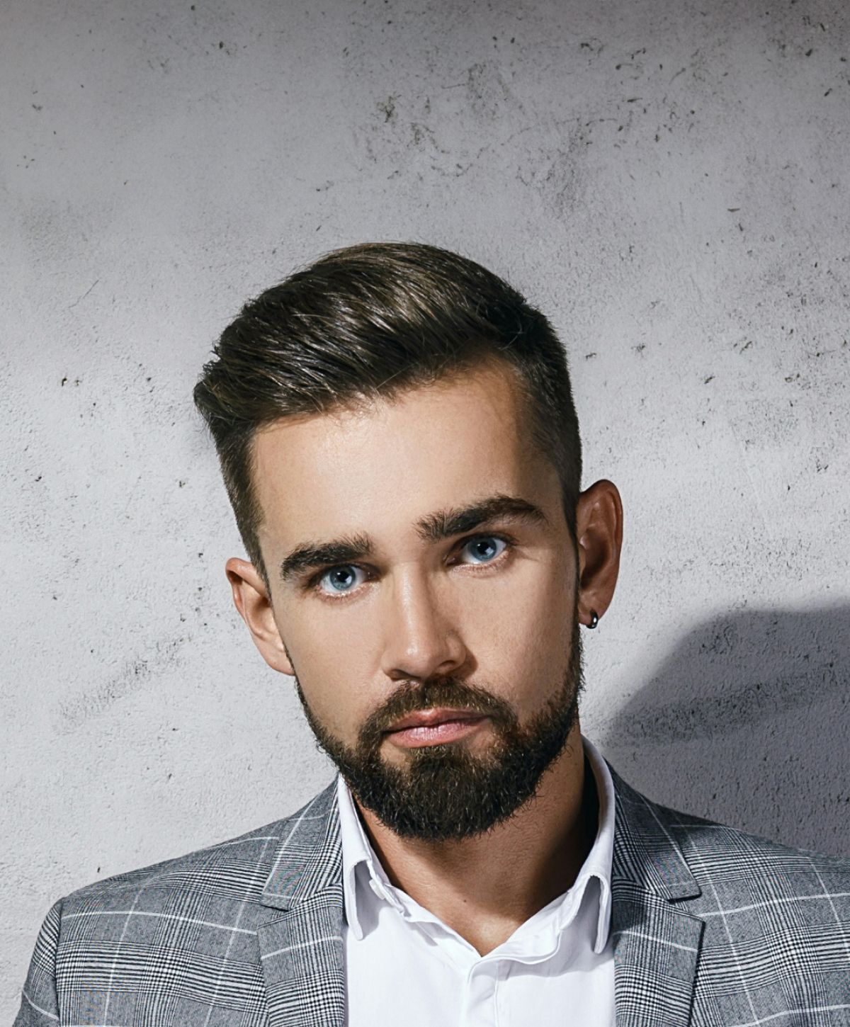 Man with beard in stylish suit portrait.