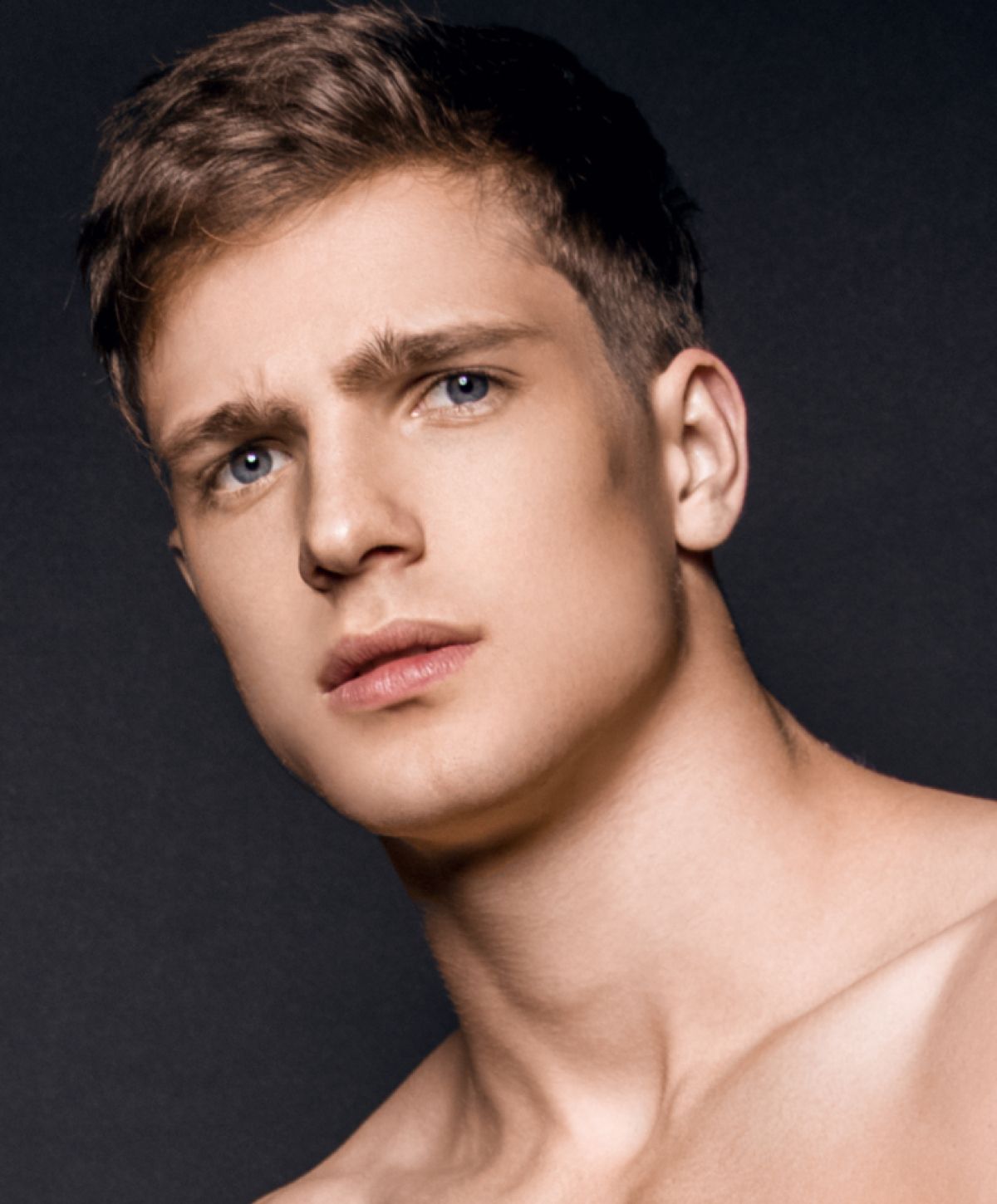 Portrait of young man with intense expression.