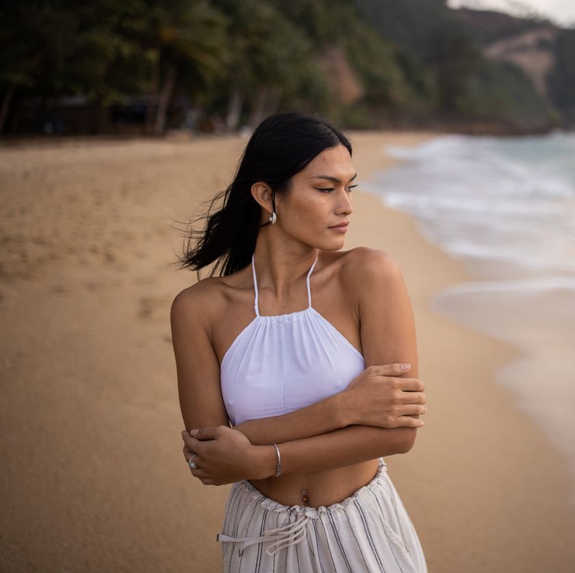 Farmington SculpSure model with curly hair and neutral makeup.