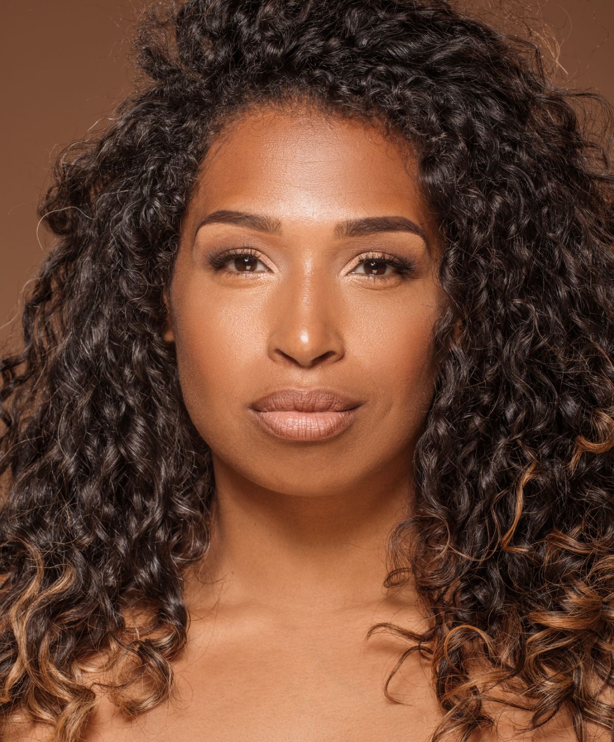 Farmington Lutronic Clarity II Laser model with curly hair and neutral makeup.