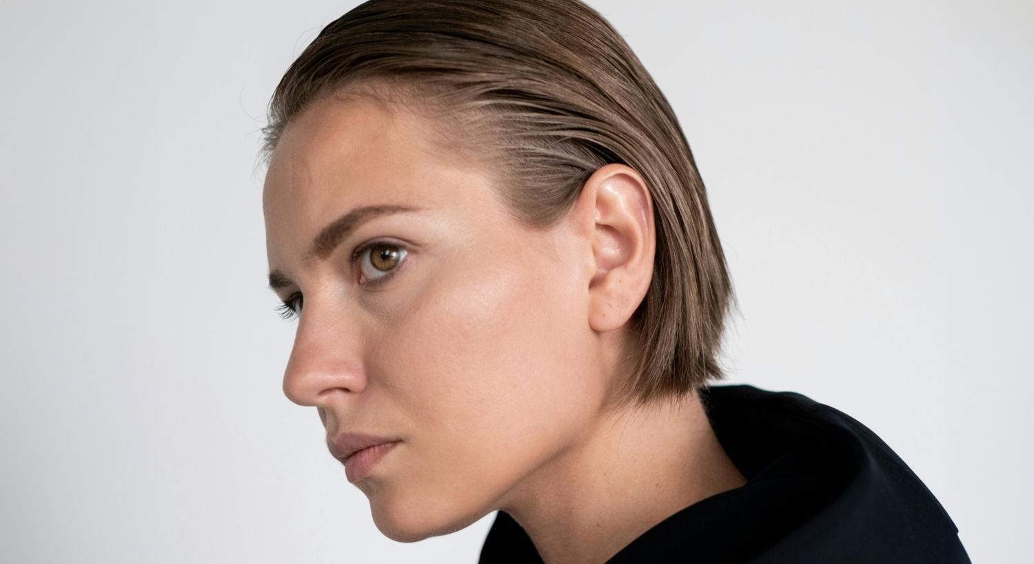 Profile of a woman with short hair.